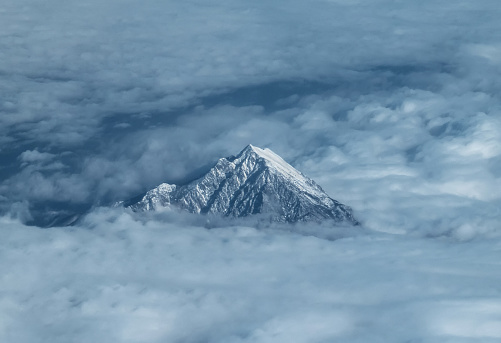 The view from the aircraft to the top of Mount Olympus in Greece among the clouds