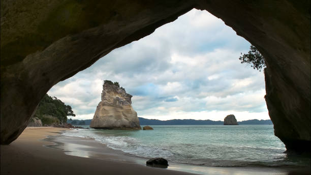 istock afternoon view of cathedral cove in nz 1133527934