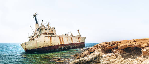 istock Old damaged rusty transportation ship after crash  on the coastline. 1133528982