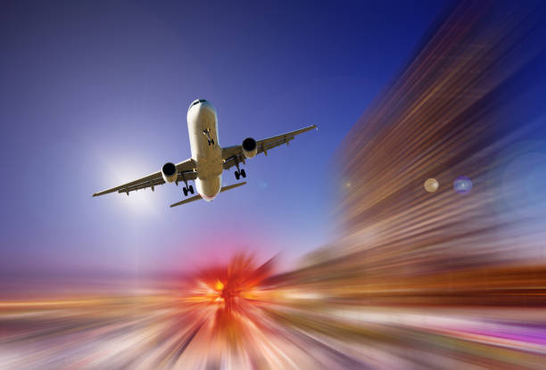 istock Big airplane in sky on blurred background 1133529002