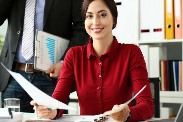 istock Group of people hold in arms financial papers solve and discuss problem 1133529402
