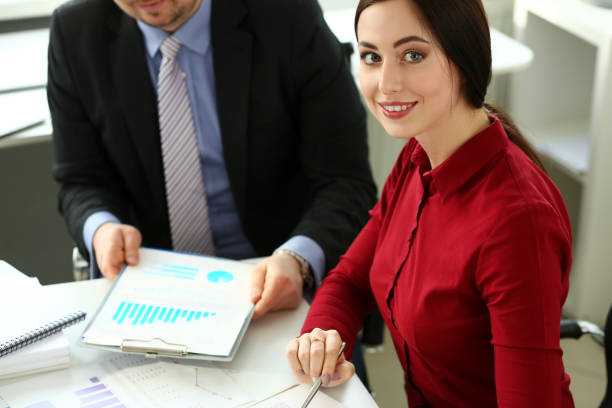 istock Group of people hold in arms financial papers solve and discuss problem 1133529418