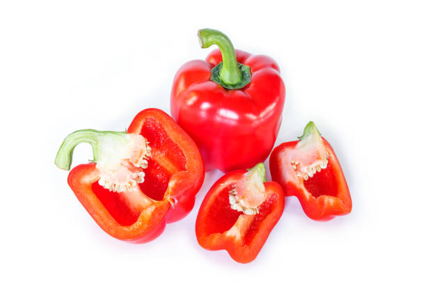 istock red bell pepper cut into pieces on white background, top view. 1133531223