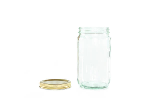 istock Empty jar of golden cap is open on a white background. 1133531380