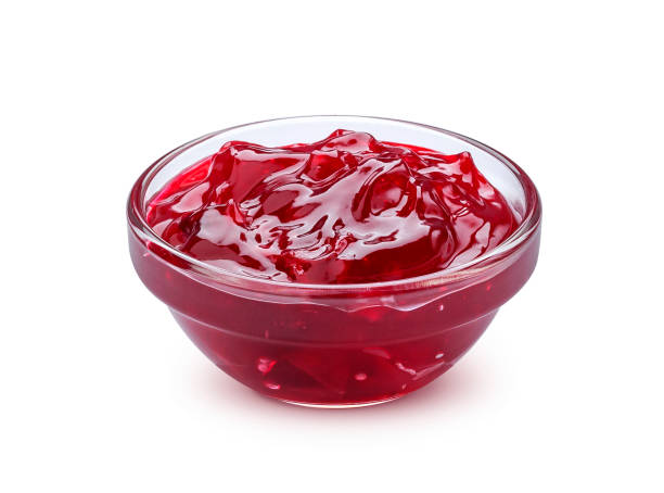 istock Red berry jam isolated on white background 1133532115