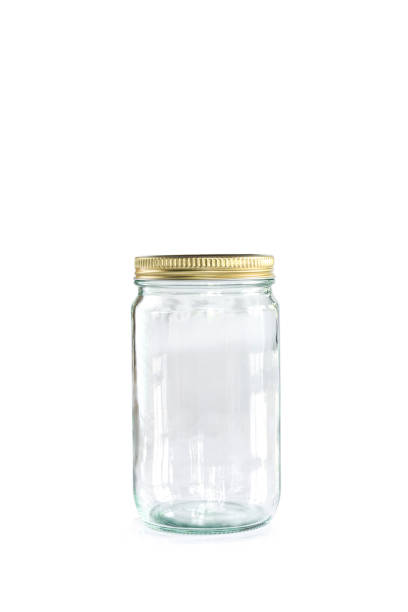 istock Empty jar of golden cap is closing on a white backgrond. 1133532224