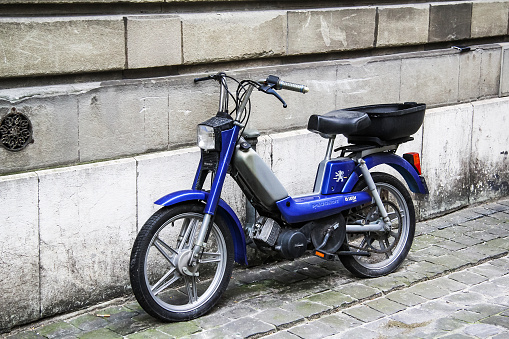 Electric bike in front of the entrance gate to the San Siro stadium in Milan, Italy
