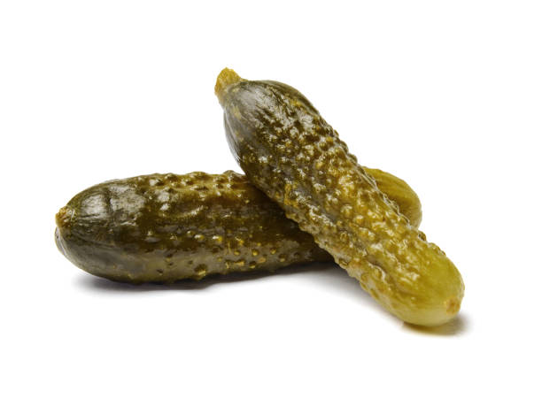 istock Appetizing salted cucumbers on white isolated background. Close-up. 1133533139
