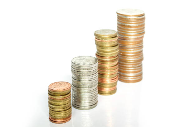 istock coins money on white background. 1133533371