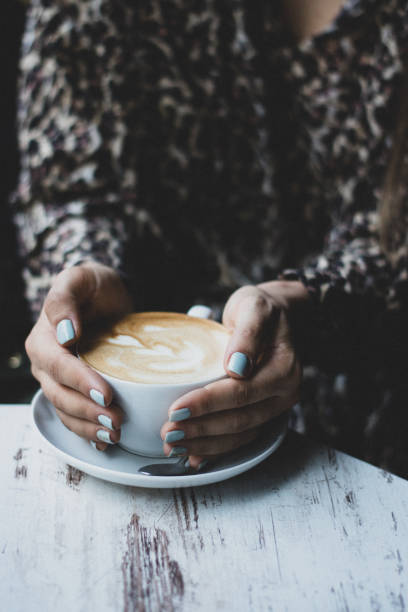 istock Lady's hands holding cup with sth heart-shaped 1133533397