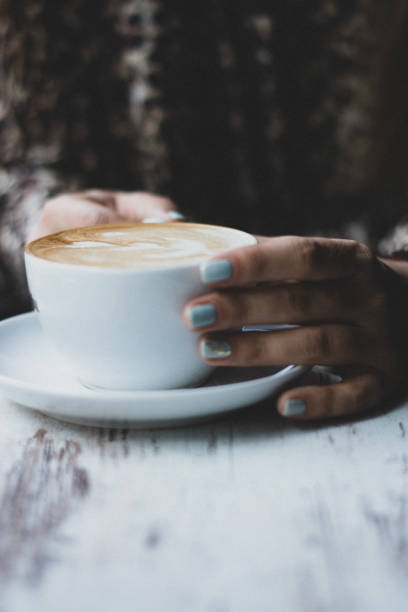 istock Lady's hands holding cup with sth heart-shaped 1133533505