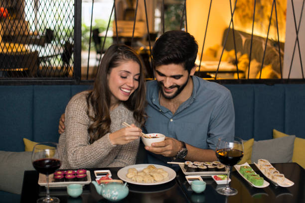 istock Young couple eating in a restaurant 1133534113