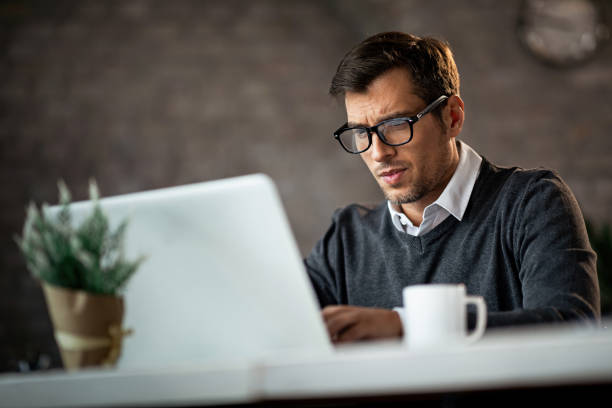 istock Dedicated businessman working on a computer in the office. 1133536479