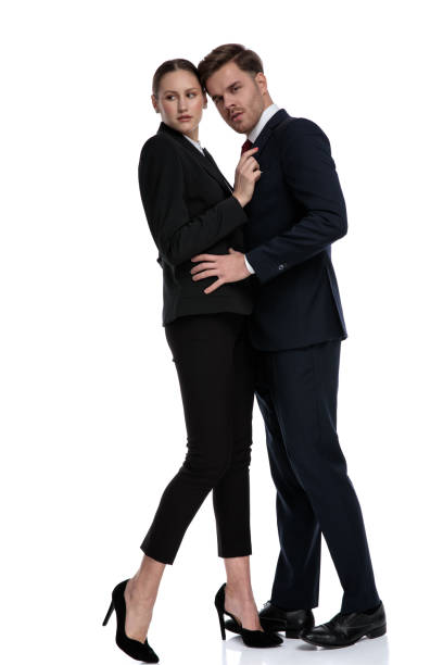 istock couple in business suits holding hands on each other 1133540966