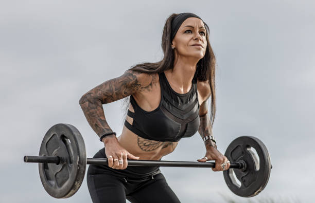istock Tattooed Senior Woman During Workout 1133541147