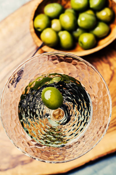 Martini cocktail with green olive