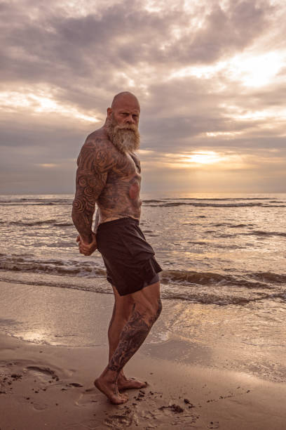 istock Tattooed Senior Man During Workout 1133541520