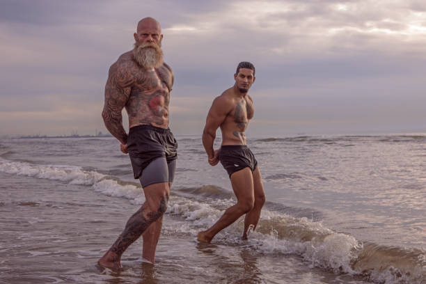 istock Tattooed Senior Man coaching young man During Workout 1133541561