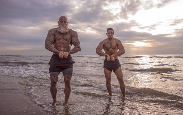 istock Tattooed Senior Man coaching young man During Workout 1133541783