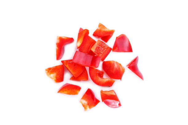 istock red bell pepper cut into pieces on white background. 1133543467