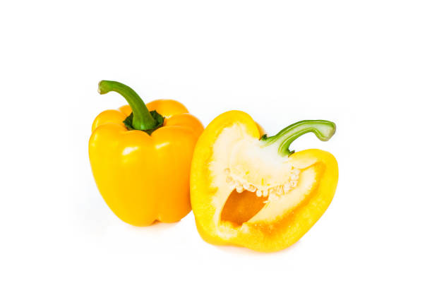 istock yellow bell pepper cut into pieces on white background, top view. 1133543484