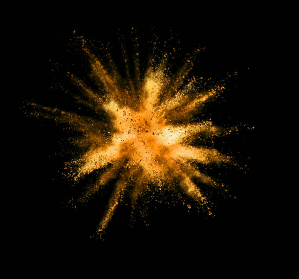 istock Explosion of golden powder on black background 1133543485