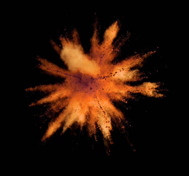 istock Explosion of golden powder on black background 1133543491