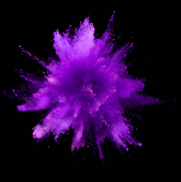 istock Explosion of purple powder on black background 1133543495