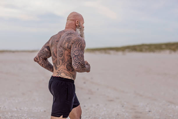 istock Tattooed Senior Man During Workout 1133543624