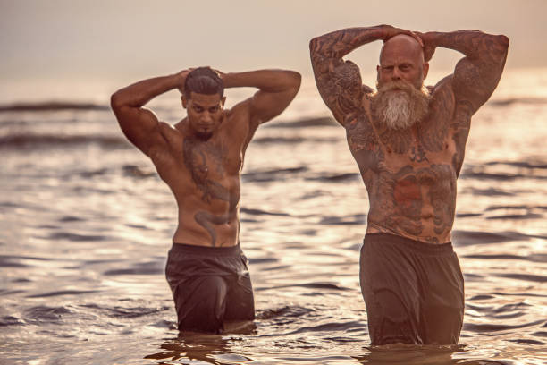 istock Tattooed Senior Man coaching young man During Workout 1133543815