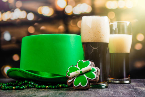 St Patricks Day background Two glasses of ale and St Patricks day accessories. Bar background. Copy space cauldron photos stock pictures, royalty-free photos & images