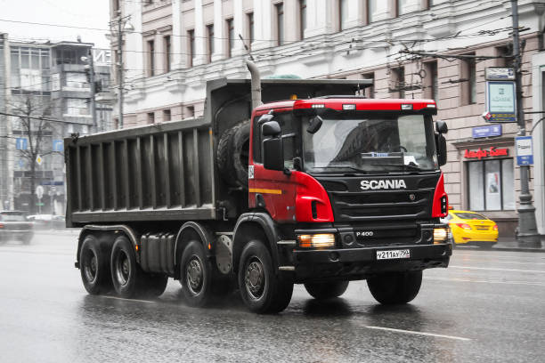 Scania P400 Moscow, Russia - March 8, 2015: Dump truck Scania P400 in the city street. truck in rain stock pictures, royalty-free photos & images