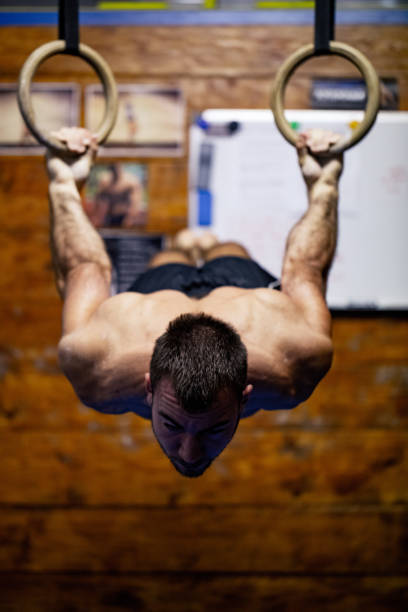 istock Young Adult Athlete Practicing on Gymnastic Rings 1133544320