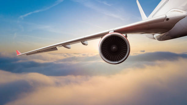 istock Commercial jet airplane flying above clouds 1133545215