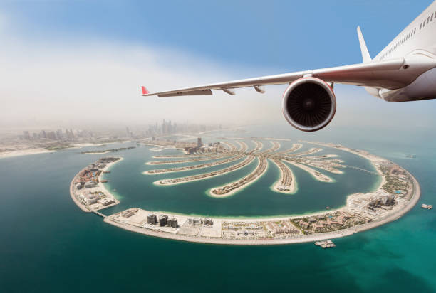 istock Commercial jet plane flying above Dubai city. 1133545285