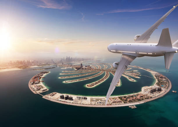 istock Commercial jet plane flying above Dubai city. 1133545314
