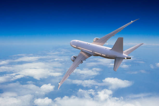 istock Passengers commercial airplane flying above clouds 1133545342