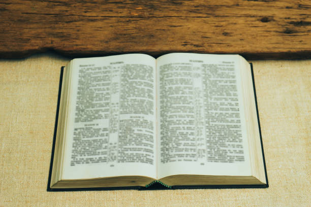 istock Open Holy Bible on a old  table. Beautiful background. Religion concept. 1133546315