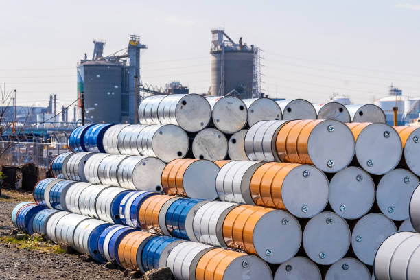 Metal Oil barrels Industry oil chemical metal barrels stacked up in waste yard of tank and container, Kawasaki city near Tokyo Japan barrel stock pictures, royalty-free photos & images