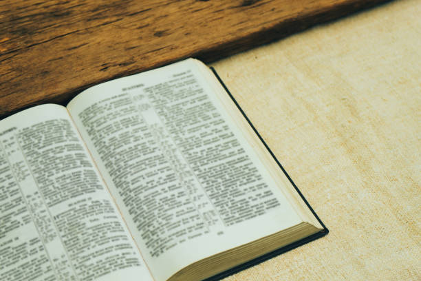 istock Open Holy Bible on a old  table. Beautiful background. Religion concept. 1133547047