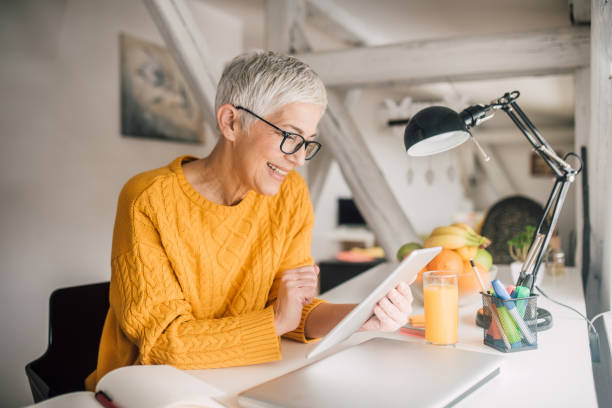 istock Woman looking at digital tablet 1133547093