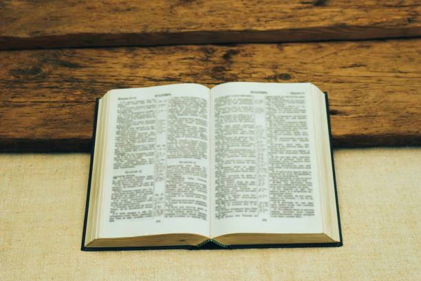 istock Open Holy Bible on a old  table. Beautiful background. Religion concept. 1133547107