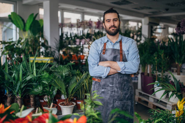 istock Handsome florist at the flower shop 1133548106