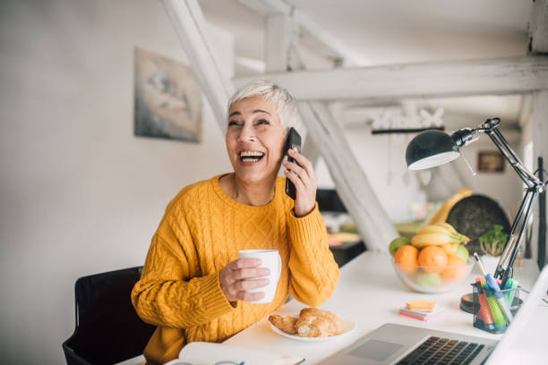 istock Woman talking on phone and smiling 1133548271