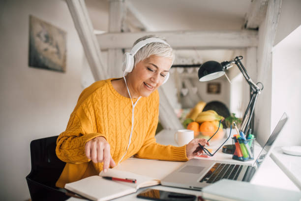 istock Older woman working from home 1133548359