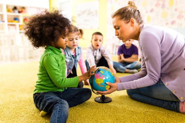 istock Small kids having geography class at preschool 1133550127