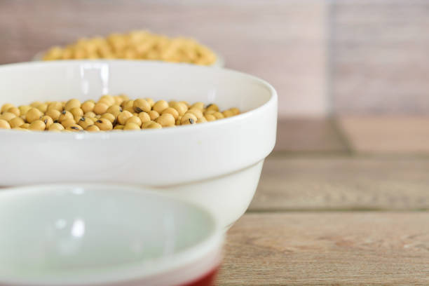 istock Soybean in a white bowl on wooden floor 1133550340