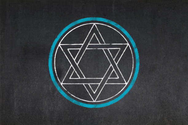 Blackboard with a the Alpha & Omega sign drawn in the middle. It represent the beginning and the end; the Omnipotence and omnipresence. Symbolizes the eternity of God.