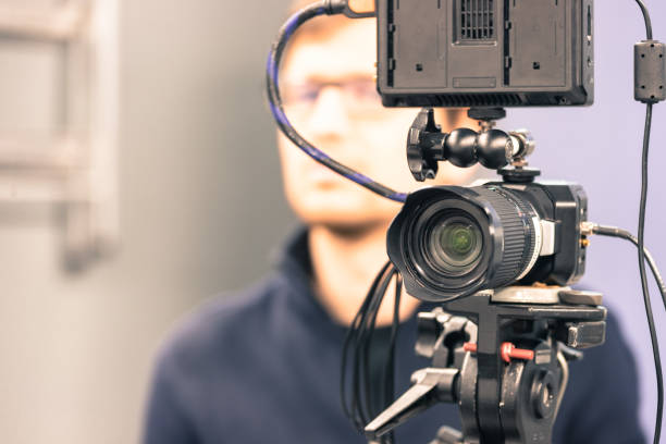 istock Modern film camera and cameraman in a broadcasting studio 1133559971