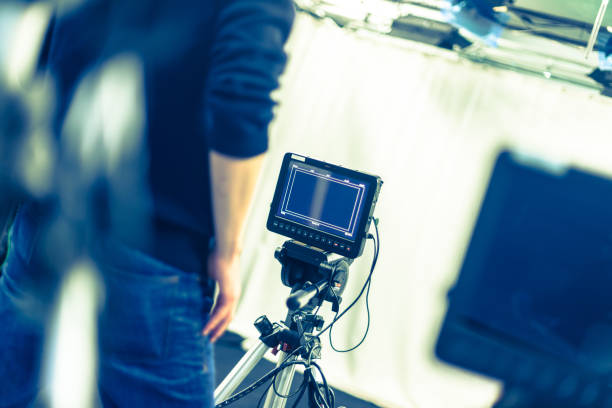 istock Modern film camera and cameraman in a broadcasting studio 1133560007